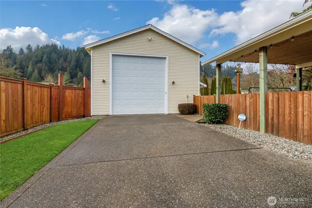 a front view of house with yard and trees