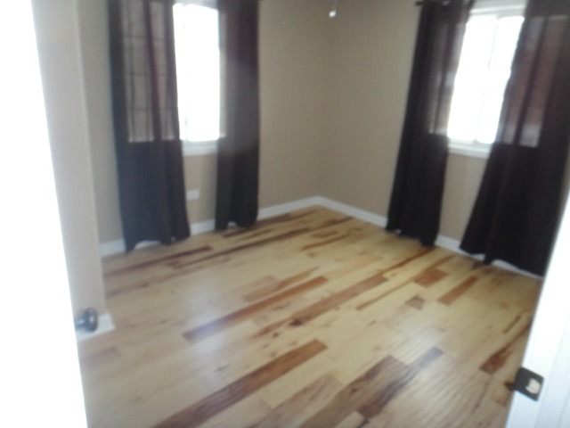 5711 Willow Springs Road Countryside, IL 60525 - Photo 12 of 19 a bedroom with a bed and a window