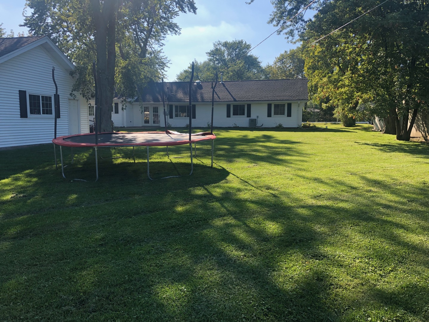5711 Willow Springs Road Countryside, IL 60525 - Photo 18 of 19 a swimming pool with outdoor seating and yard