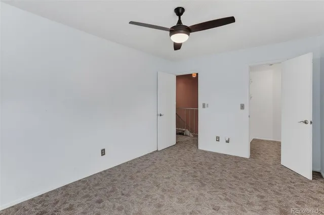 an empty room with closet area