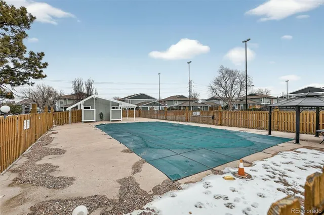 a view of a house with yard and lake view