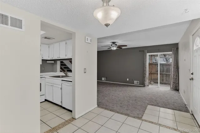 a view of a kitchen with cabinets