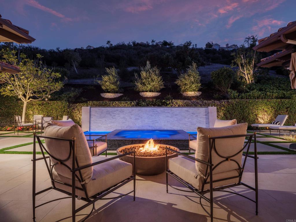 a view of a chairs and table in patio