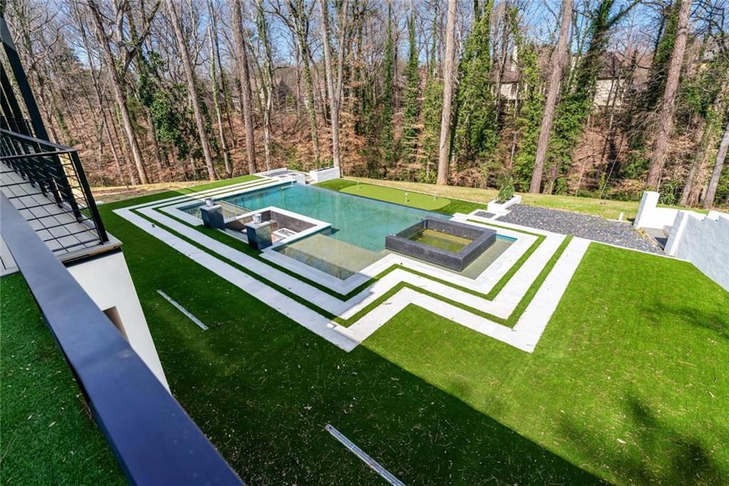 1355 Moores Mill Road Northwest Atlanta, GA 30327 - Photo 36 of 45 a view of a backyard with sitting area