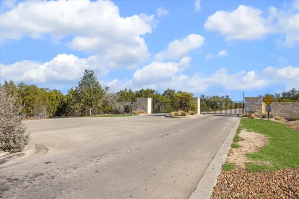 a view of a road with a building in the background