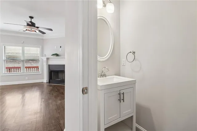 a white toilet sitting next to a bathroom sink