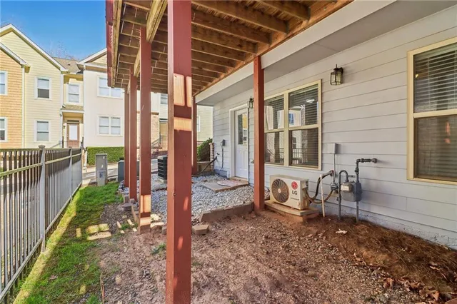 a front view of a house with a yard and glass windows