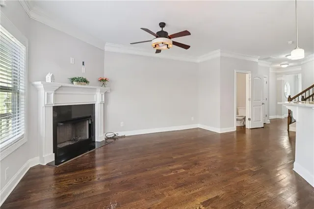 a view of a kitchen with a sink wooden cabinet and a refrigerator