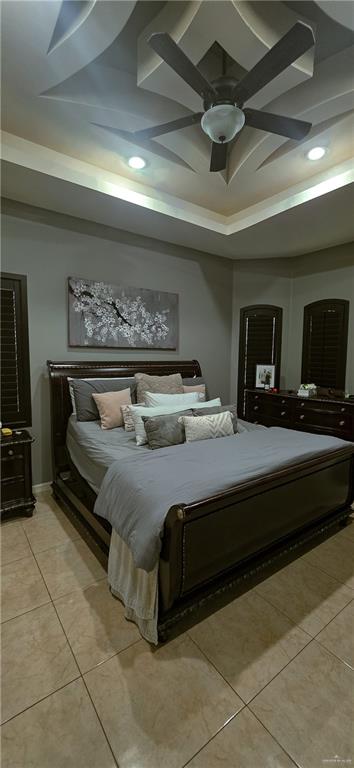 1305 Mountain Road Mission, TX 78573 - Photo 16 of 43 a bedroom with a bed and a tv on wall