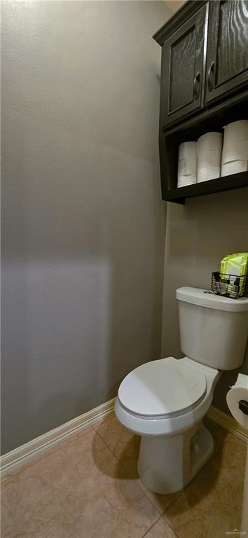 1305 Mountain Road Mission, TX 78573 - Photo 20 of 43 a white toilet sitting next to a bathroom sink