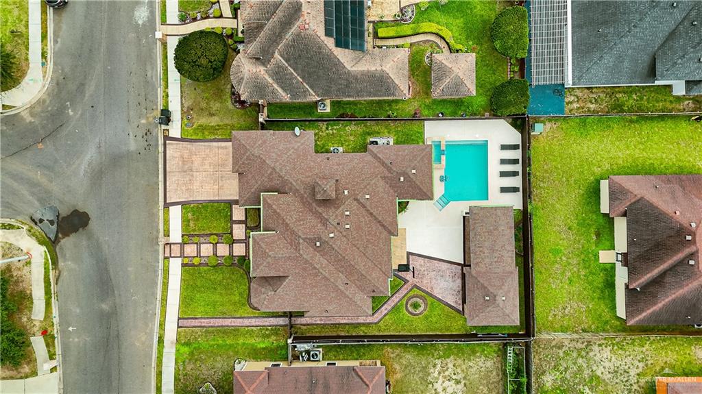 1305 Mountain Road Mission, TX 78573 - Photo 2 of 43 an aerial view of a house with swimming pool outdoor seating and yard