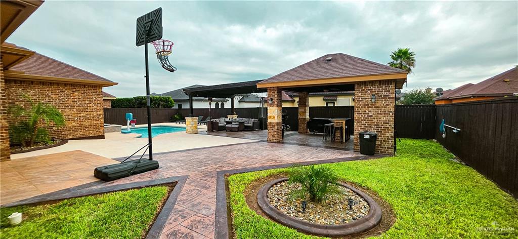 1305 Mountain Road Mission, TX 78573 - Photo 32 of 43 a patio with a table and chairs