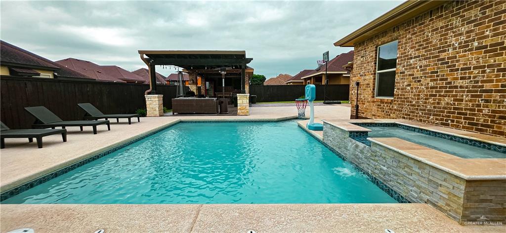 1305 Mountain Road Mission, TX 78573 - Photo 39 of 43 a backyard of a house with table and chairs