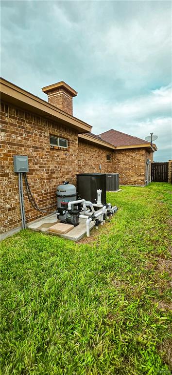 1305 Mountain Road Mission, TX 78573 - Photo 42 of 43 a backyard of a house with table and chairs