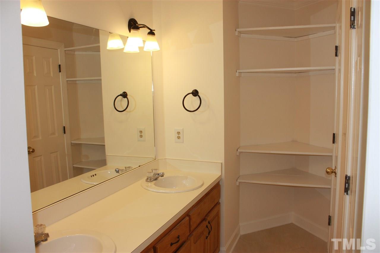 7924 Footman Way Raleigh, NC 27615 - Photo 13 of 17 The large 2nd floor full bath has new tile flooring and fixtures.