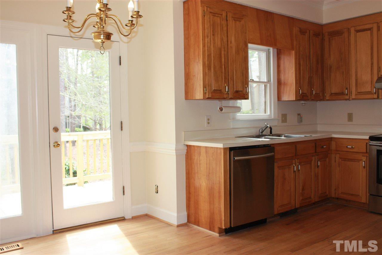 7924 Footman Way Raleigh, NC 27615 - Photo 7 of 17 This kitchen has of cabinet space, a pantry and a desk.