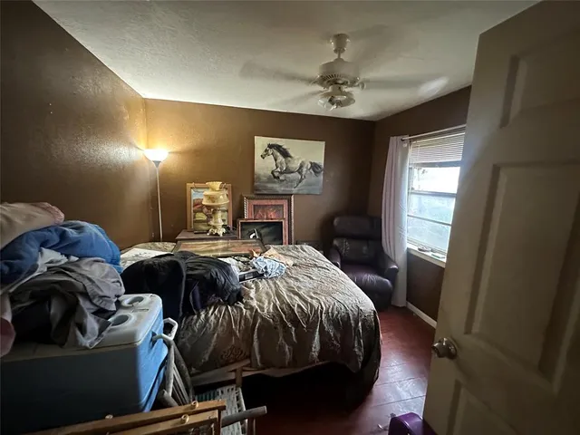 a bedroom with a bed and window