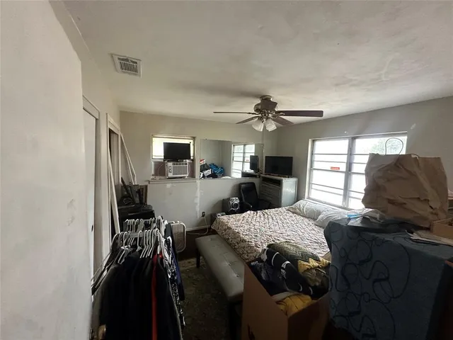 a living room with furniture and flat screen tv