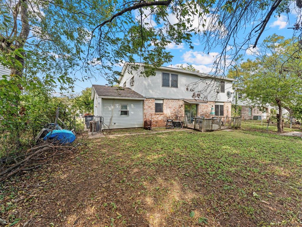 654 Rutgers Drive Lancaster, TX 75134 - Photo 4 of 18 a view of a house with backyard and a tree