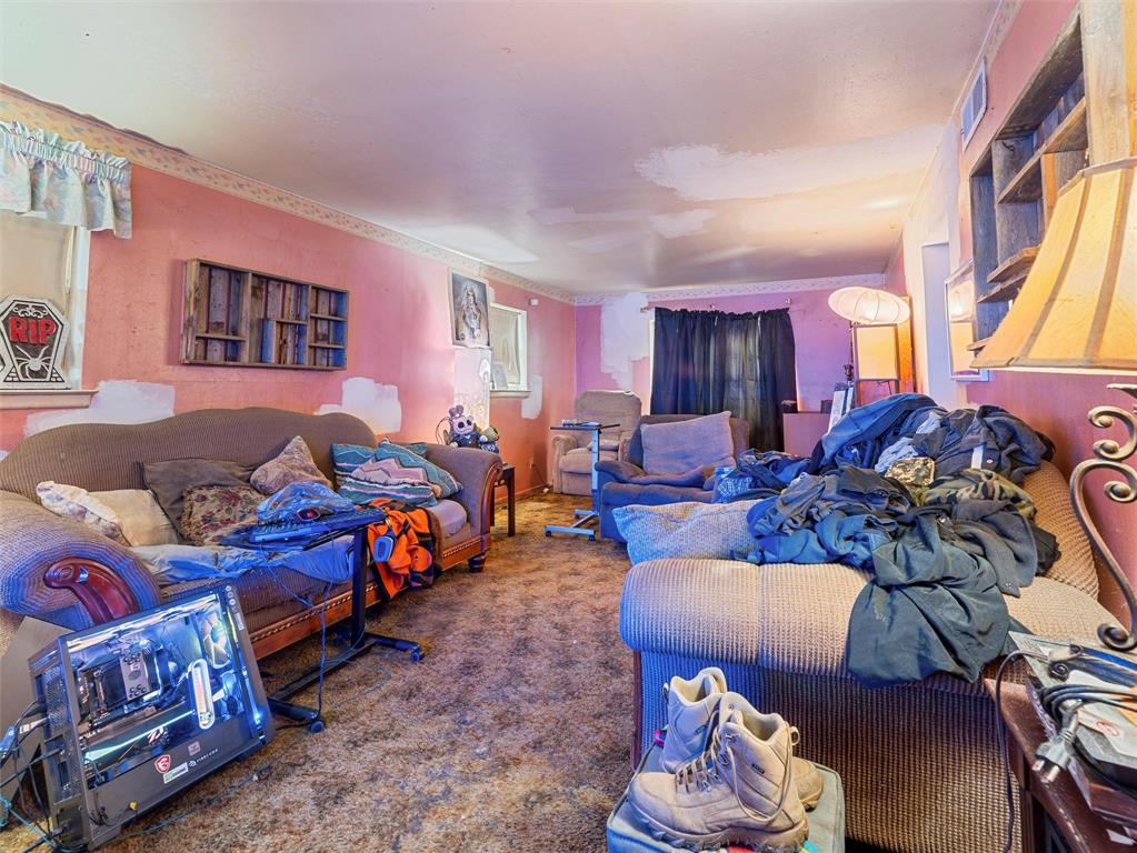 654 Rutgers Drive Lancaster, TX 75134 - Photo 5 of 18 a living room with furniture and a floor to ceiling window