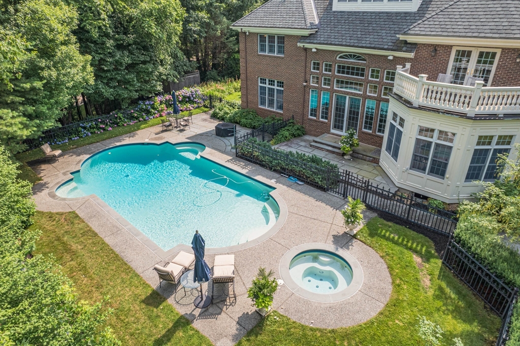 9 Regency Ridge Andover, MA 01810 - Photo 2 of 5 an aerial view of a house with swimming pool and garden
