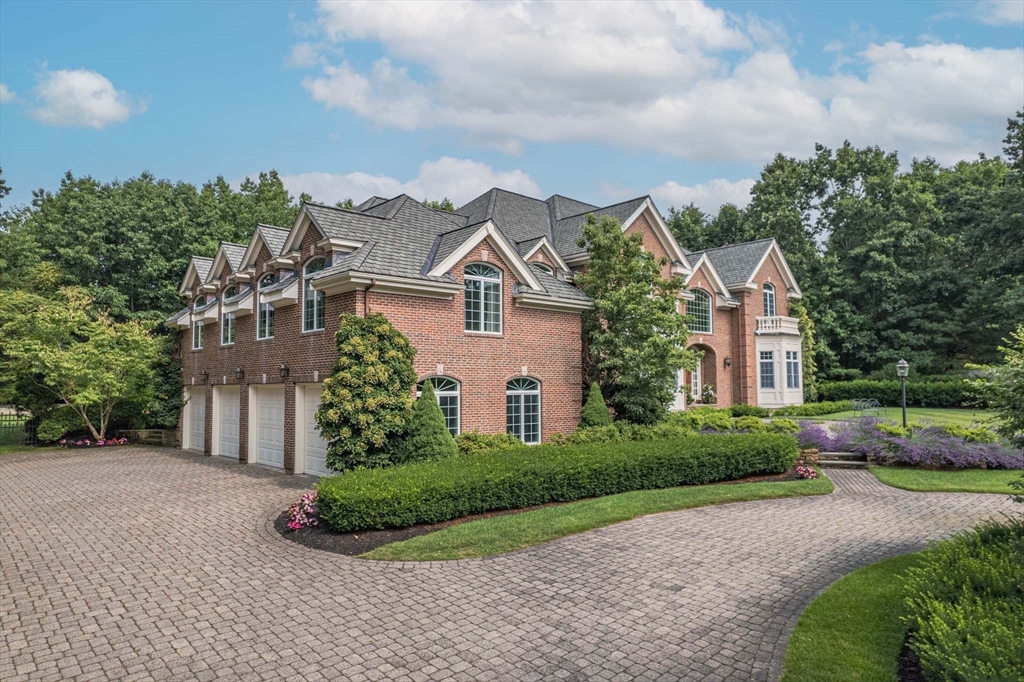 9 Regency Ridge Andover, MA 01810 - Photo 4 of 5 a front view of a house with a garden