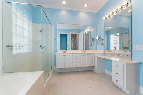 a bathroom with a bathtub and a shower