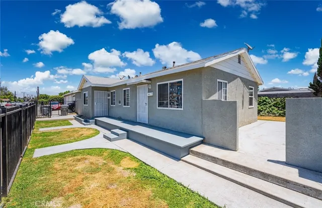 a swimming pool with some potted plants