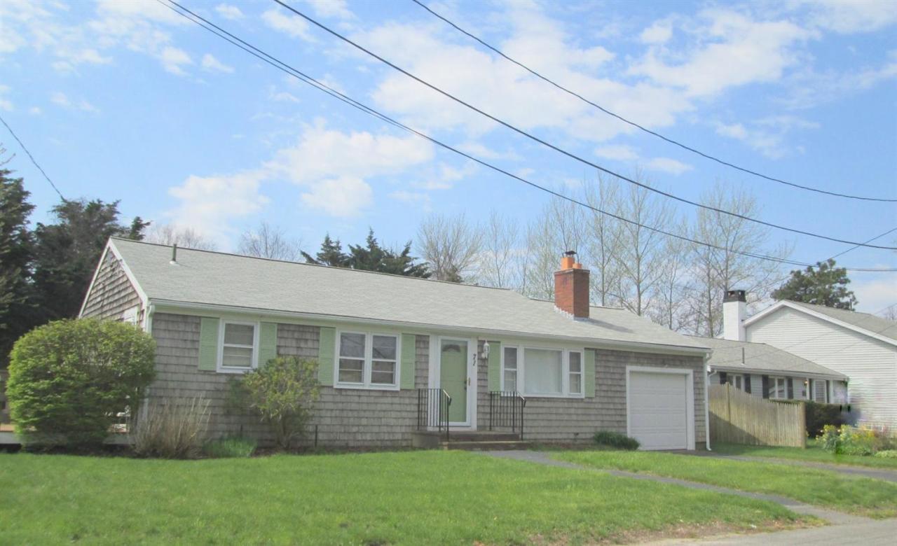 71 Seabrook Road Hyannis, MA 02601 - Photo 1 of 13 a front view of a house with a garden