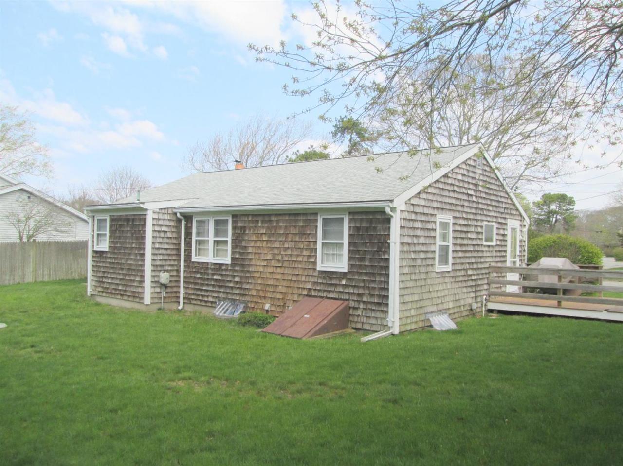 71 Seabrook Road Hyannis, MA 02601 - Photo 13 of 13 front view of a house with a yard