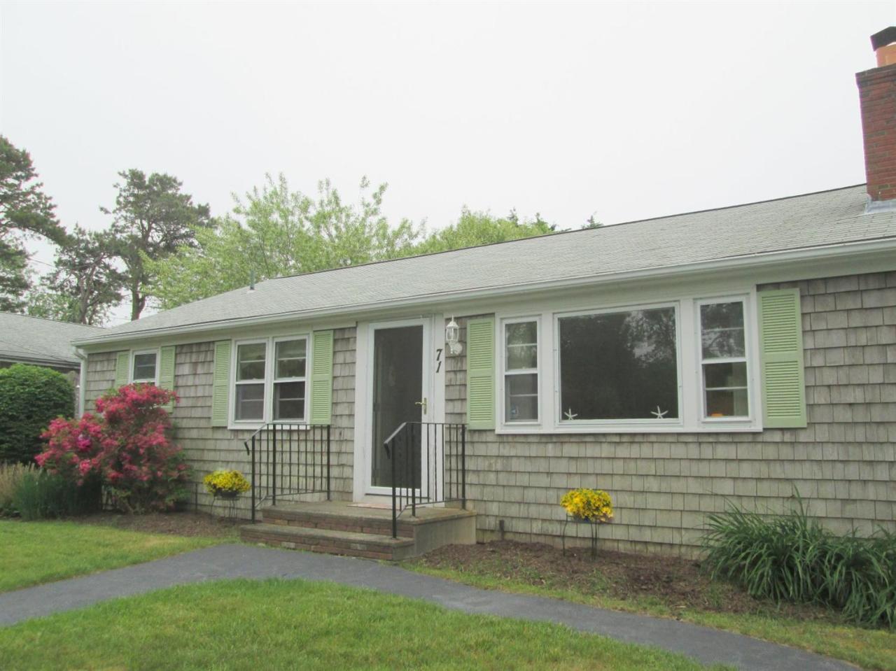 71 Seabrook Road Hyannis, MA 02601 - Photo 2 of 13 a front view of a house with garden