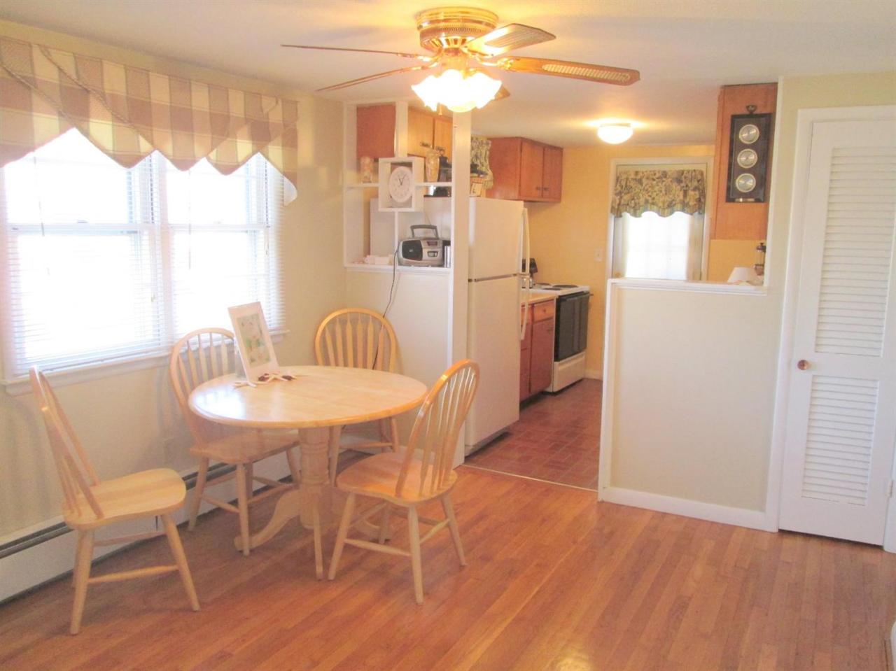 71 Seabrook Road Hyannis, MA 02601 - Photo 4 of 13 a view of a dining room with furniture window and wooden floor