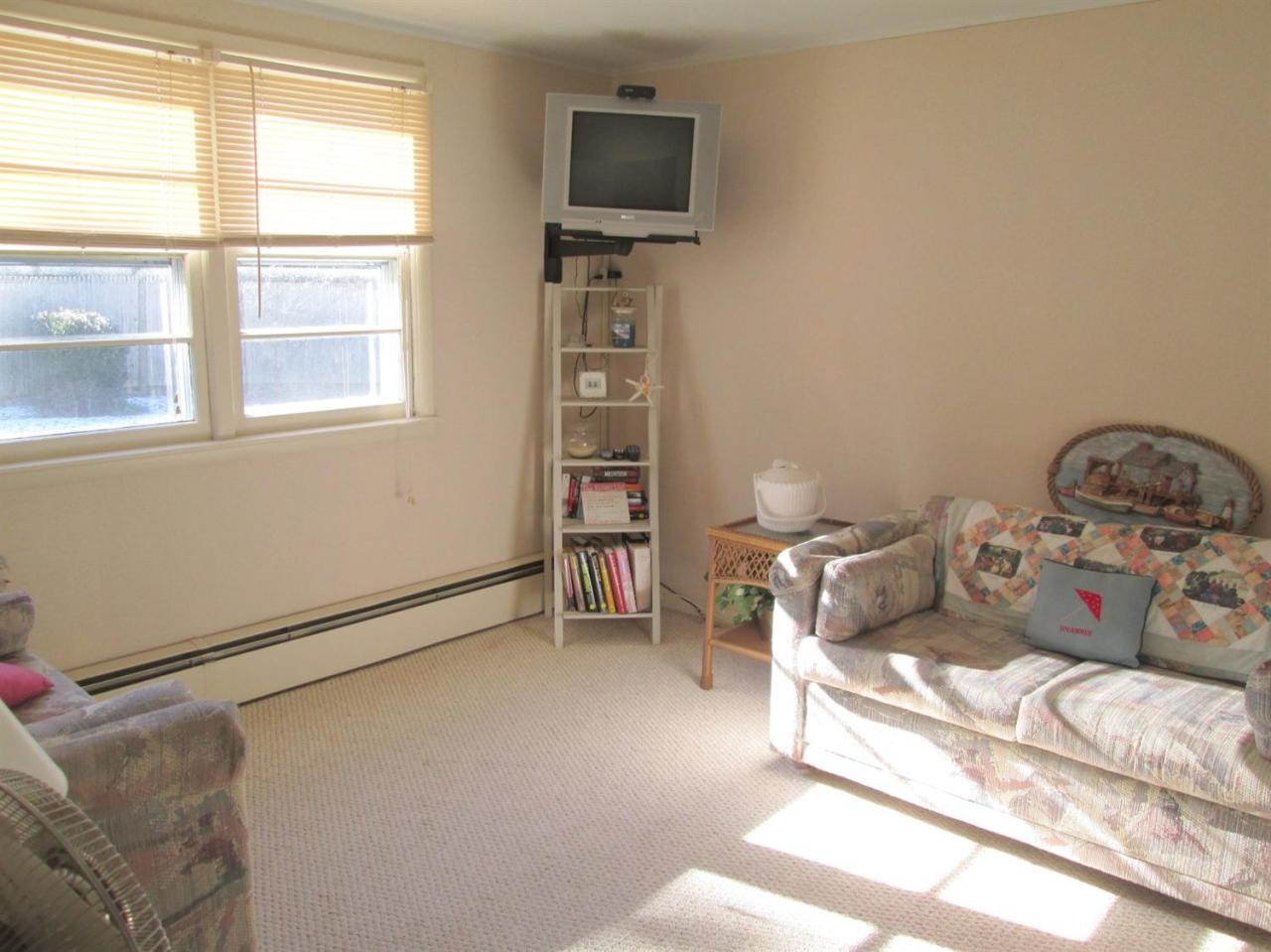 71 Seabrook Road Hyannis, MA 02601 - Photo 8 of 13 a bed room with a bed and a tv