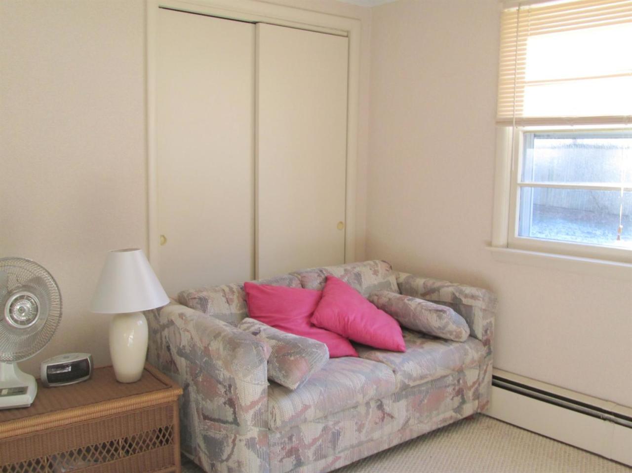 71 Seabrook Road Hyannis, MA 02601 - Photo 9 of 13 a bedroom with a bed and a window