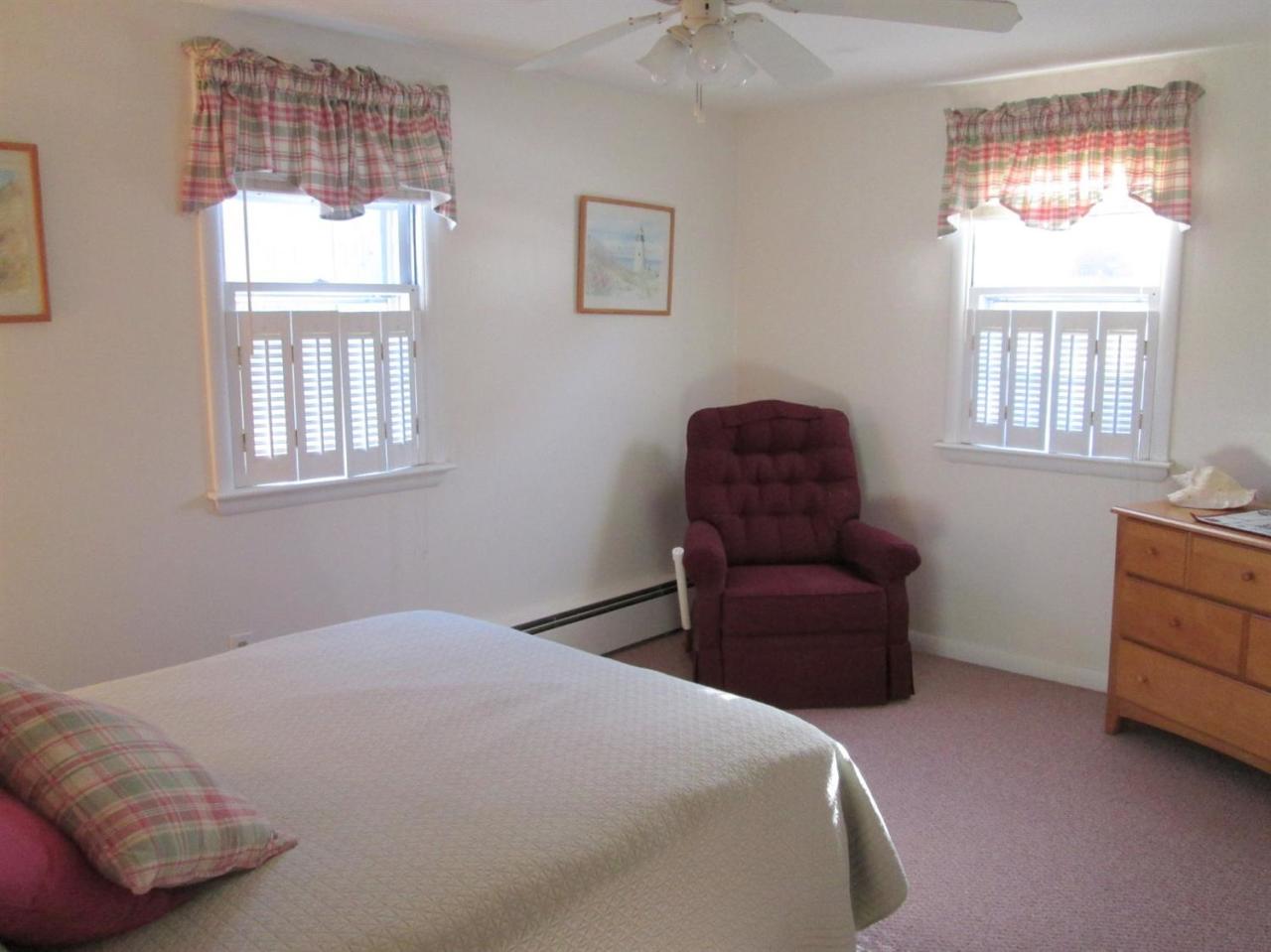 71 Seabrook Road Hyannis, MA 02601 - Photo 10 of 13 a bedroom with a bed and a couch