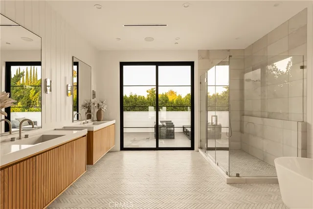 a bathroom with a double vanity sink and a bathtub