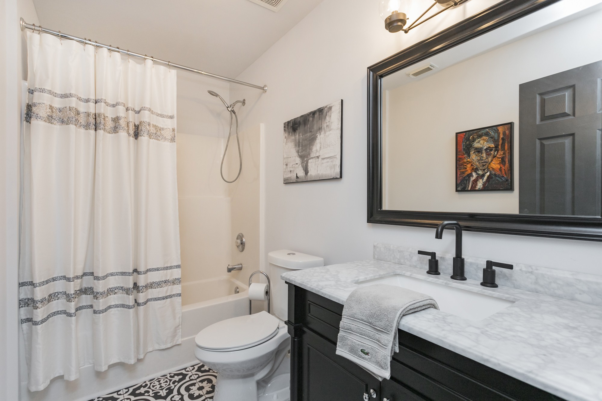 7596 Cherokee Hills Road Fairview, TN 37062 - Photo 25 of 31 a bathroom with a granite countertop sink a toilet and a mirror
