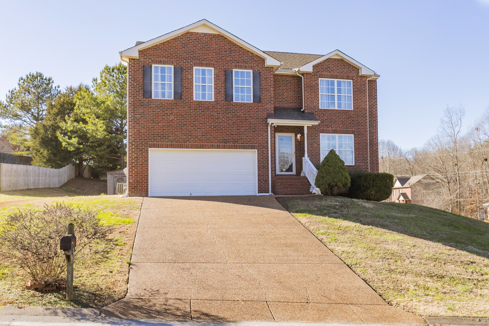 7596 Cherokee Hills Road Fairview, TN 37062 - Photo 28 of 31 a front view of a house with a yard and garage