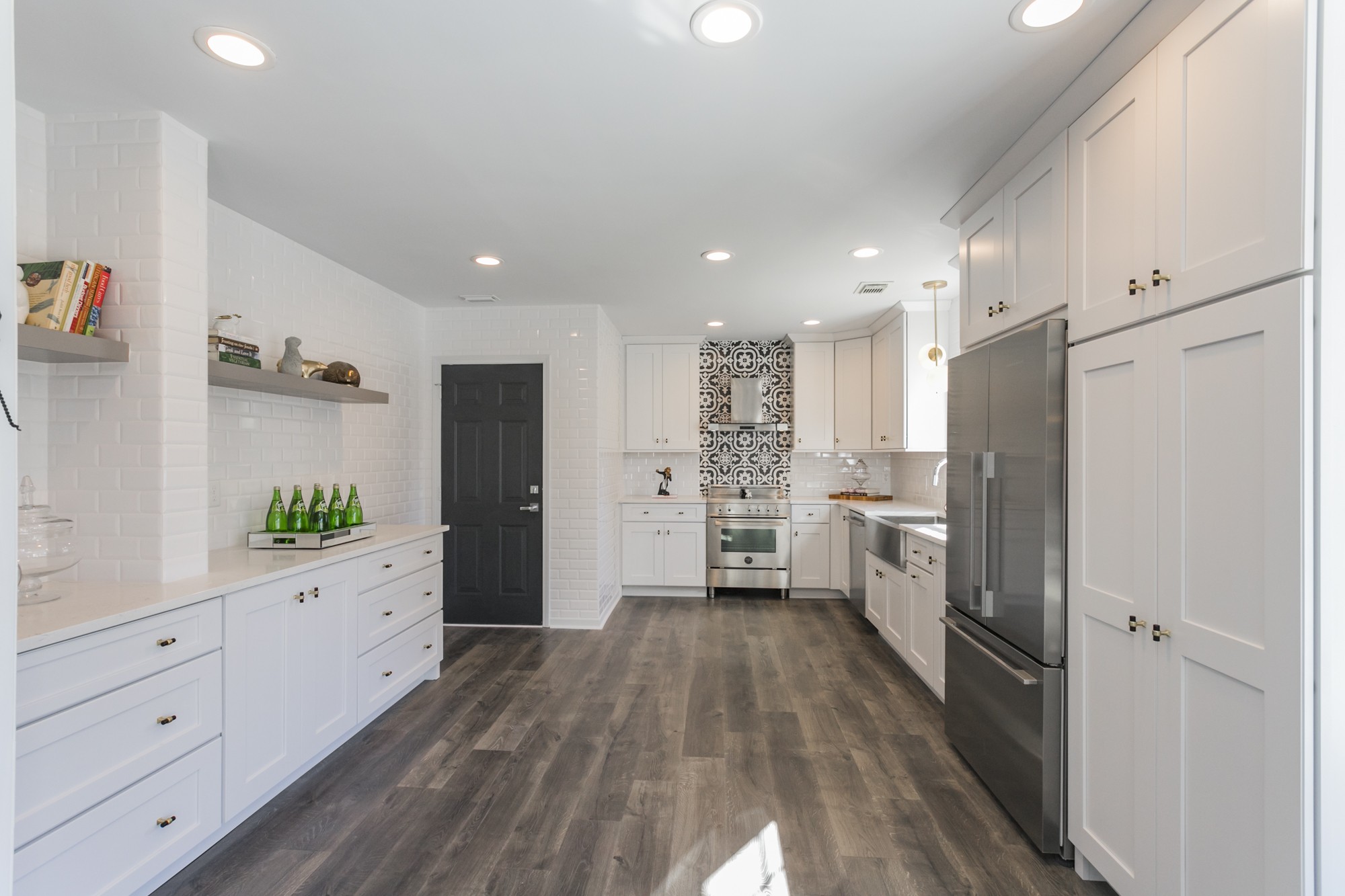 7596 Cherokee Hills Road Fairview, TN 37062 - Photo 8 of 31 a kitchen with white cabinets and wooden floor