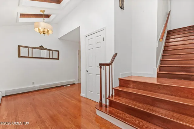 a view of entryway with wooden floor