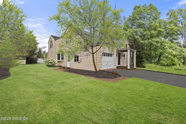 a view of house with yard
