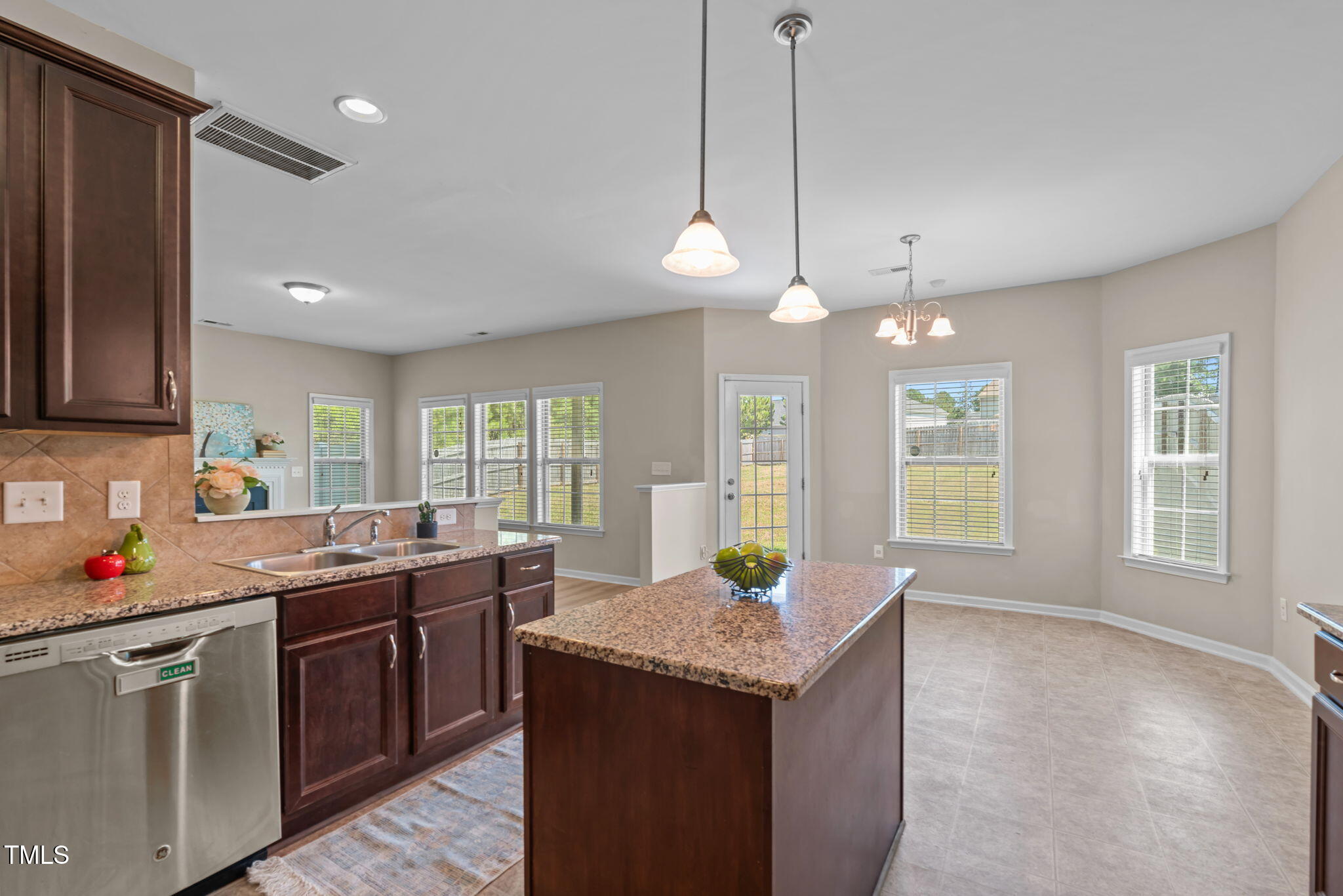 60 Taplow Trail Cameron, NC 28326 - Photo 8 of 50 a kitchen with granite countertop a sink a counter space appliances and cabinets