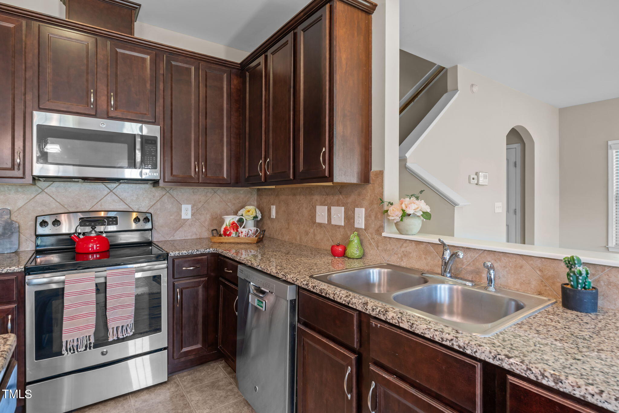 60 Taplow Trail Cameron, NC 28326 - Photo 10 of 50 a kitchen with stainless steel appliances granite countertop a sink stove and cabinets