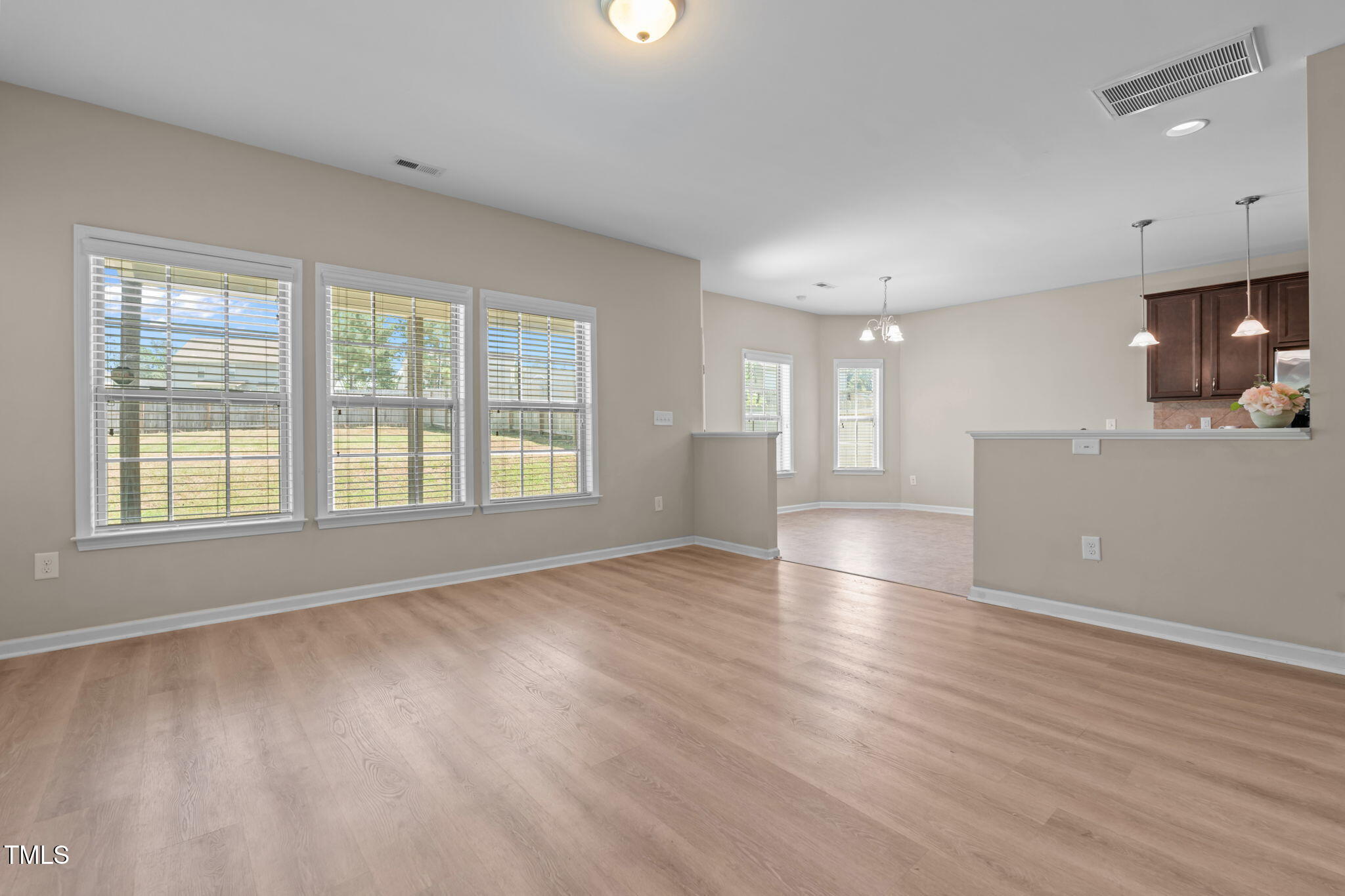 60 Taplow Trail Cameron, NC 28326 - Photo 13 of 50 an empty room with wooden floor and windows