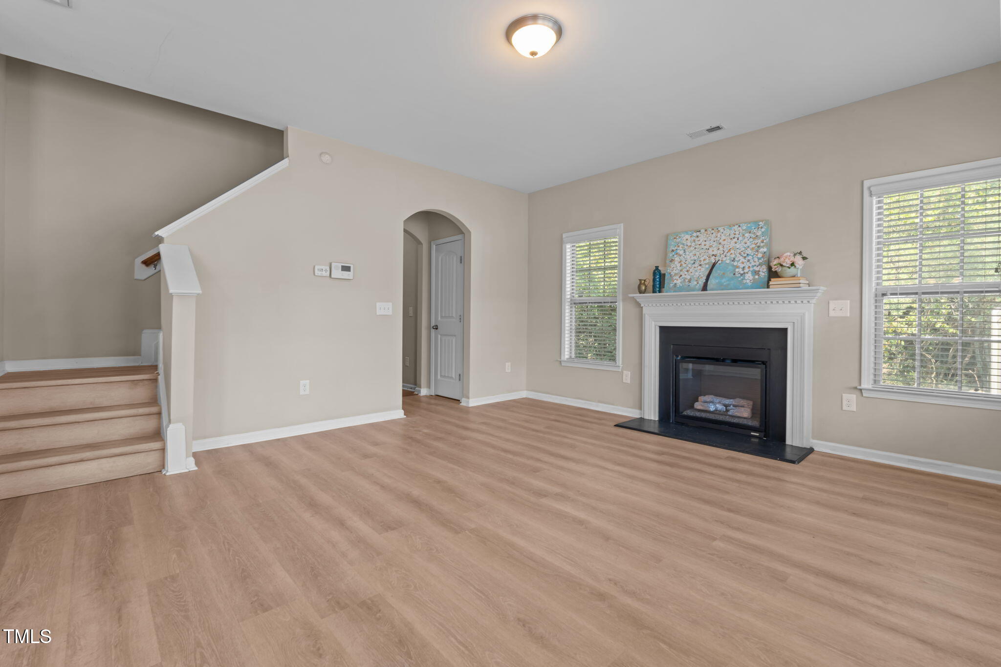 60 Taplow Trail Cameron, NC 28326 - Photo 15 of 50 a view of an empty room with wooden floor fireplace and a window