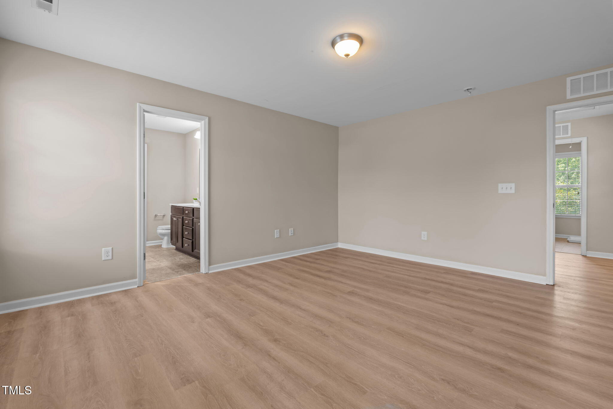 60 Taplow Trail Cameron, NC 28326 - Photo 20 of 50 a view of an empty room with wooden floor and a window