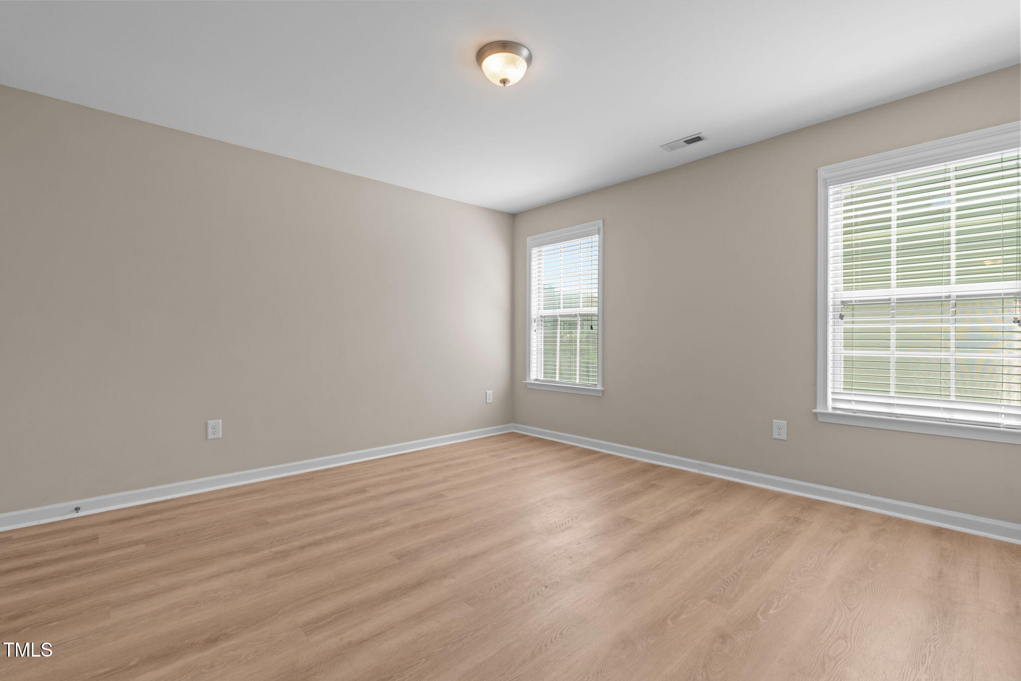 60 Taplow Trail Cameron, NC 28326 - Photo 26 of 50 a view of an empty room with wooden floor and a window