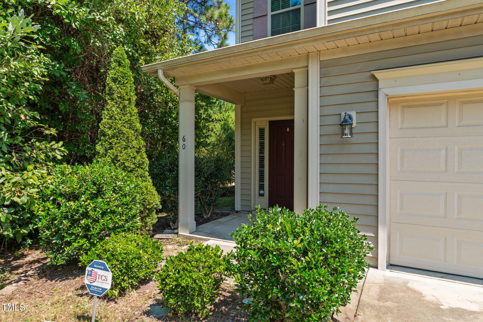60 Taplow Trail Cameron, NC 28326 - Photo 3 of 50 front view of a house with potted plants