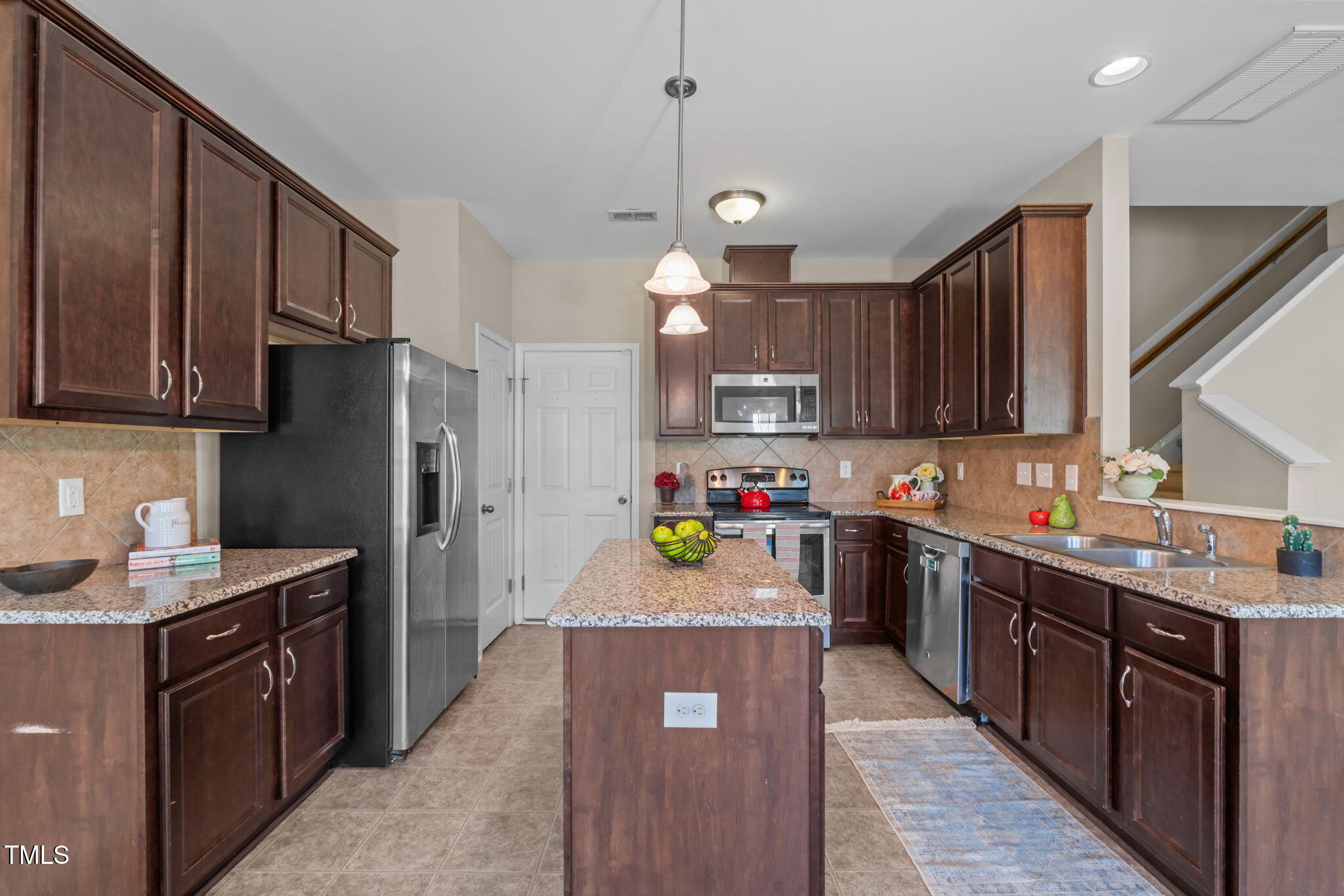 60 Taplow Trail Cameron, NC 28326 - Photo 6 of 50 a kitchen with kitchen island a sink stainless steel appliances and cabinets