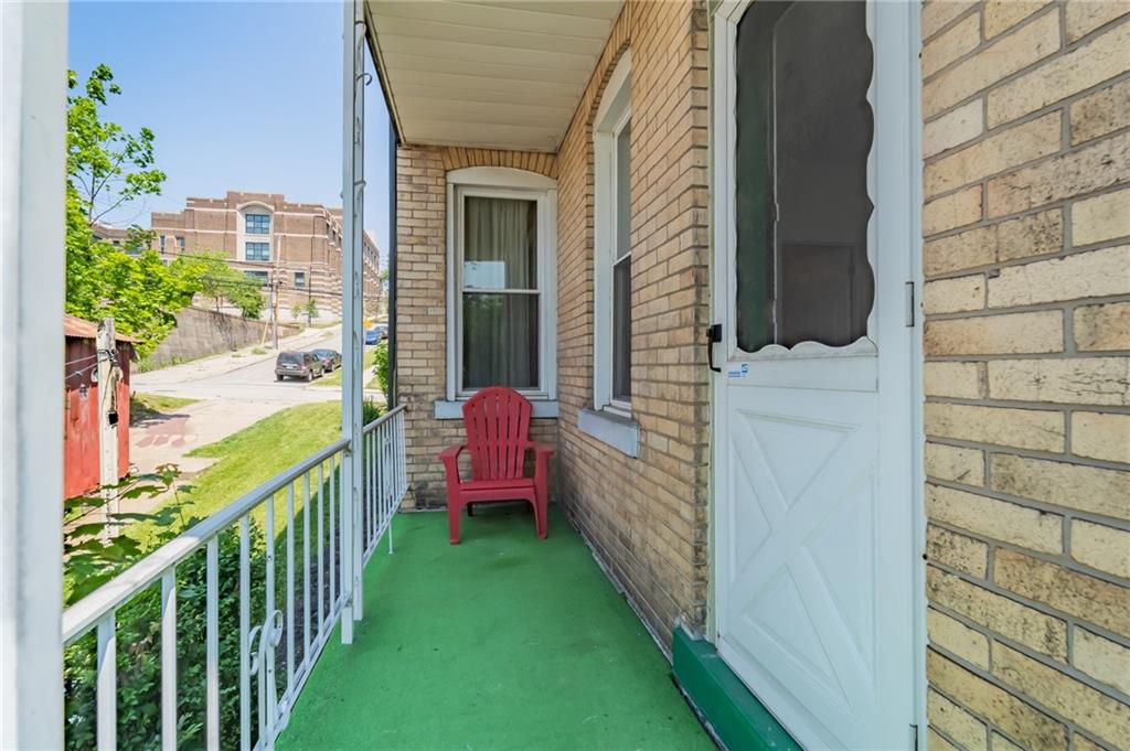 102 Secane Avenue Pittsburgh, PA 15211 - Photo 40 of 50 a view of a porch with wooden floor